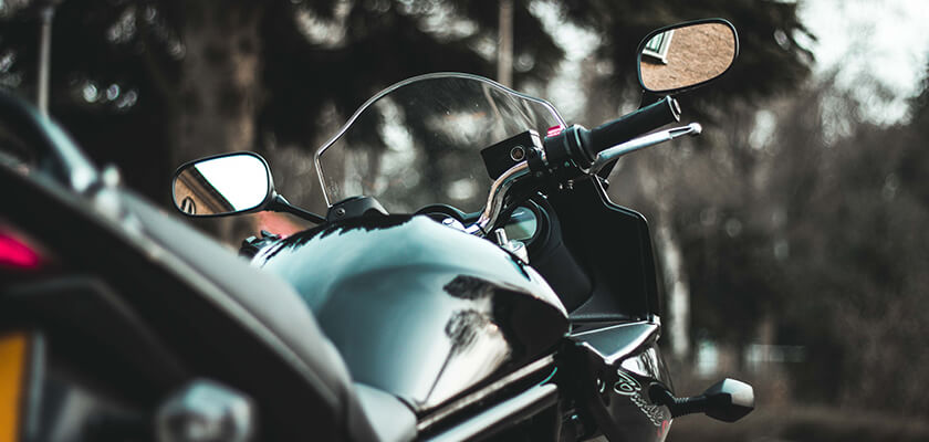 Motorcycle resting on the side of the road