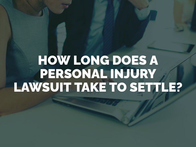 woman and her attorney looking at personal injury lawsuit